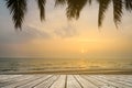 Wooden terrace over tropical island beach with coconut palm at sunset or sunrise time Royalty Free Stock Photo