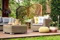 Wooden terrace with yellow pouf