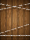 Wooden texture with barbed wire.