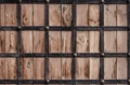Wooden texture framed by metal forged strips. Royalty Free Stock Photo