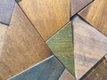 Wooden texture, natural material polygons in different colors. green, blue and brown diamonds made of wood. natural background. Royalty Free Stock Photo