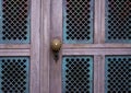 Wooden texture of old door with handle and keyhole, background