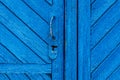 The wooden texture of the planks door, painted blue Royalty Free Stock Photo