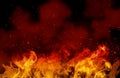 Orange fire or flames with sparkles in black background. Royalty Free Stock Photo