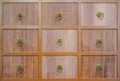 Wooden textured drawers wall background in chinese herbal medicine shop in chinese drug store Royalty Free Stock Photo