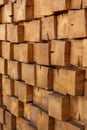 Wooden, textured wall made of wooden cubes, longitudinal cuts of fir wood. Cubes in the dioganal projection. Vertical.
