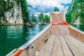 Wooden Thai boat on Ratchaprapha Dam at Khao Sok National Park