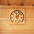 Wooden thermometer - temperature in sauna Royalty Free Stock Photo
