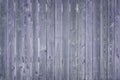 Wooden thin boards. Fragment of a dark blue vertical fence. Toned background for the site and layouts