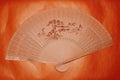 Wooden Thin Made Fan On Orange Background