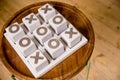 Wooden tic tac toe OX game.The concept of strategy, risk, competition in business. vintage letterpress printing block X Royalty Free Stock Photo