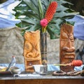 Wooden Tikis and typical Hawaiian vegetation