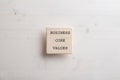 Wooden tile with a Business core value sign on it