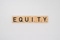 Wooden tile spelling the word equity isolated on a white background