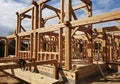 Frame construction under a partly cloudy sky. The structure features Royalty Free Stock Photo