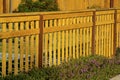 Wooden or timber front and back yard fence in suburban neighborhood downtown areas of city Royalty Free Stock Photo