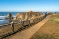 Wooden timber log walkway railing along ocean trail view. Royalty Free Stock Photo