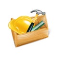 Wooden tool box with hard hat, hammer and ruler isolated