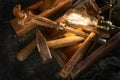 Wooden tool box of used hand tools with old and dirty, rusty wrenches, hammers and old light bulb Royalty Free Stock Photo