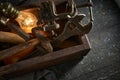 Wooden tool box of used hand tools with old and dirty, rusty wrenches, hammers and old light bulb Royalty Free Stock Photo