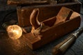 Wooden tool box of used hand tools with old and dirty, rusty wrenches, hammers and old light bulb Royalty Free Stock Photo