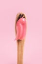 Wooden toothbrush with pink paste close-up on a pink background Royalty Free Stock Photo