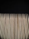 Wooden toothpicks on black background