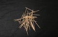 Wooden Toothpicks on Black Background with Copy Space, Flat Lay Tooth Picks, Wood Toothpicks Top View Mockup Royalty Free Stock Photo