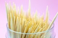 Wooden toothpicks macro photo. Close up, pink background Royalty Free Stock Photo