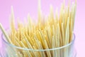 Wooden toothpicks macro photo. Close up, pink background Royalty Free Stock Photo