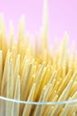 Wooden toothpicks macro photo. Close up, pink background Royalty Free Stock Photo