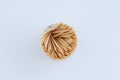 Wooden toothpicks in round package on white background close-up Royalty Free Stock Photo