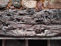 Wooden top beam with burls of an old window