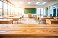 Wooden top with blurred empty classroom background Royalty Free Stock Photo
