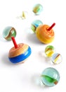 Wooden tops and marbles Royalty Free Stock Photo