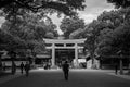 Wooden Torii gate of Meiji Jingu Shrine under big tree in Tokyo Royalty Free Stock Photo