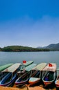 Wooden tourist boats at Tuyen Lam lake or Ho Tuyen Lam in Da Lat - Vietnam with blue sky in spring season