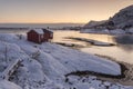 Wooden tourist cabin, rorbu, on nordic winter coast in Lofoten w Royalty Free Stock Photo