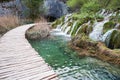 Wooden tourist pathway passing through waterfalls