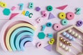 Wooden toy abacus, numbers, blocks, pastel color on pink background. Natural no plastic toys for creativity development. Royalty Free Stock Photo