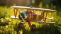 Wooden toy airplane on the grass in the park. Vintage style