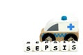 wooden toy ambulance and a word sepsis Royalty Free Stock Photo