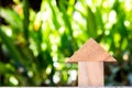 Wooden toy as dream house concept with blurred green background Royalty Free Stock Photo