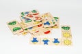 Wooden toy for baby, children isolated on white background. Domino game with different color images. Royalty Free Stock Photo
