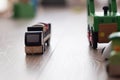 Wooden toy black lorry on a hardwood indoor floor Royalty Free Stock Photo