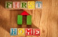 Wooden Toy Blocks Spell First Home