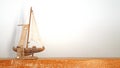 Wooden toy boat ship on wood board Royalty Free Stock Photo