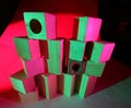 Wooden toy bricks in colored light Royalty Free Stock Photo