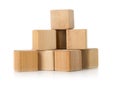 Wooden toy building block pieces stacked over white - project management or development concept Royalty Free Stock Photo