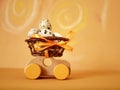 Wooden toy car with a basket of quail eggs on a bright yellow background painted in pastel, the concept of Easter holidays Royalty Free Stock Photo